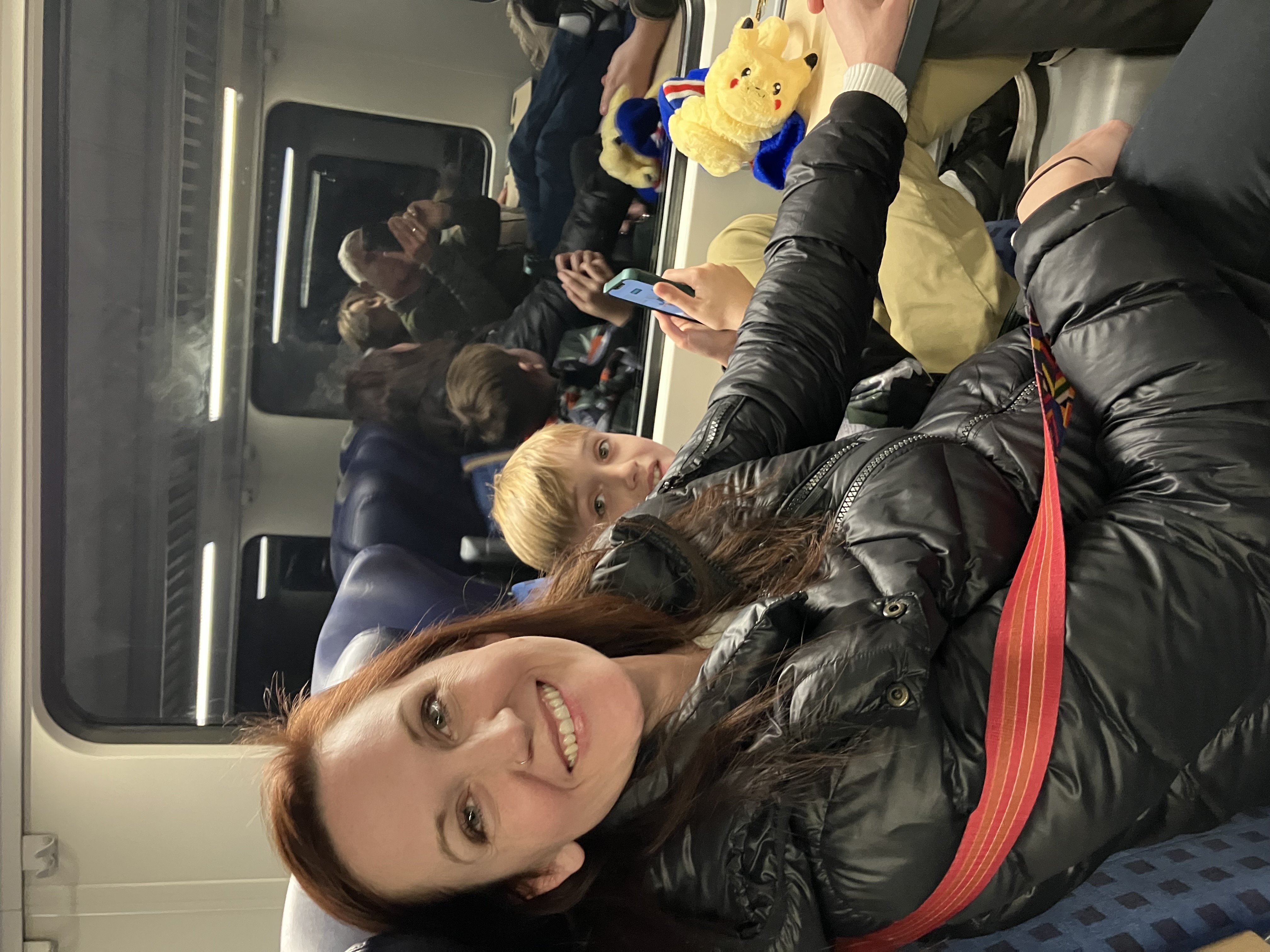 Kristin smiling on a European train